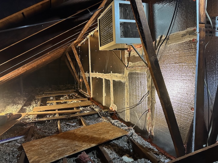 The attic kneewalls after sheathing with foam board