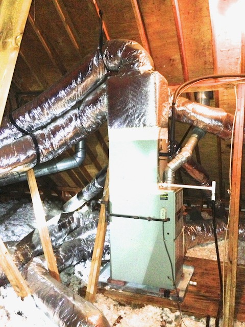 Air handler in an unconditioned attic installed vertically