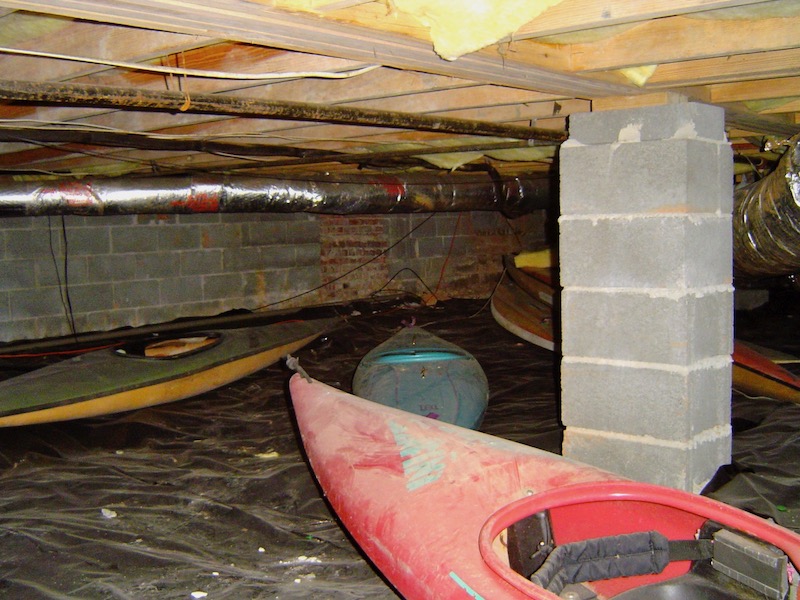 Kayaks in a damp crawl space