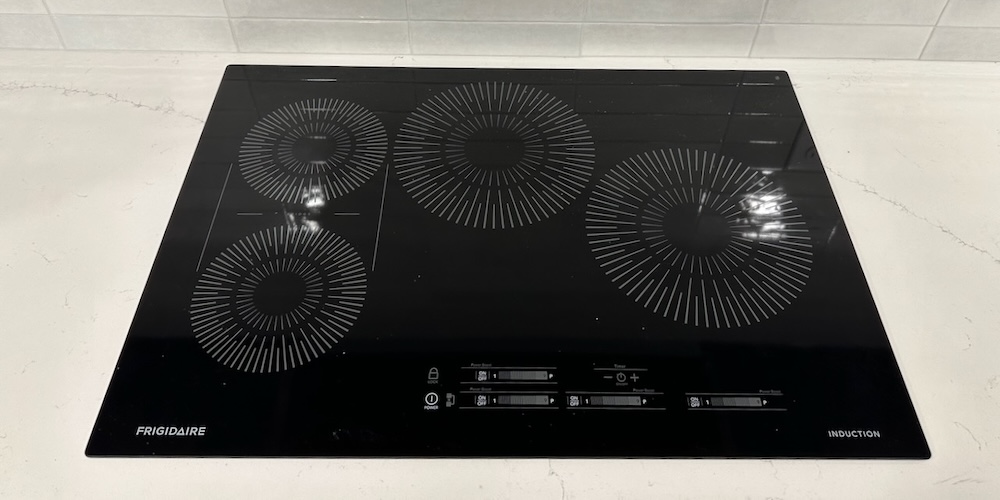 An Induction Cooktop Uses Faraday's Law Of Induction To Heat Pots And Pans, Which Then Cook Food Or Boil Water