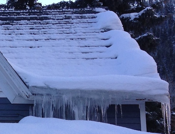 roof ice dam attic heat loss cute house closeup