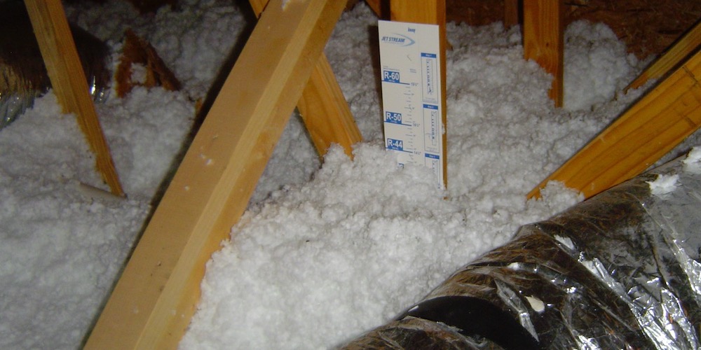 Vented Attic With Blown Fiberglass Insulation On The Attic Floor