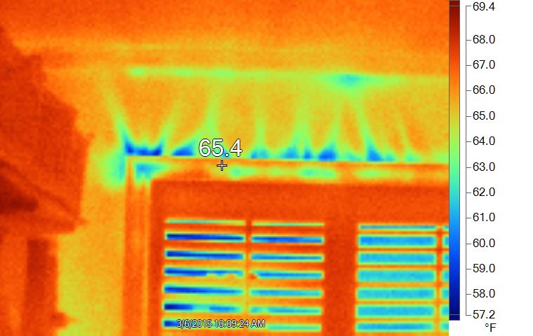 Infrared image of heat loss around  window due to air leakage, with blower door running